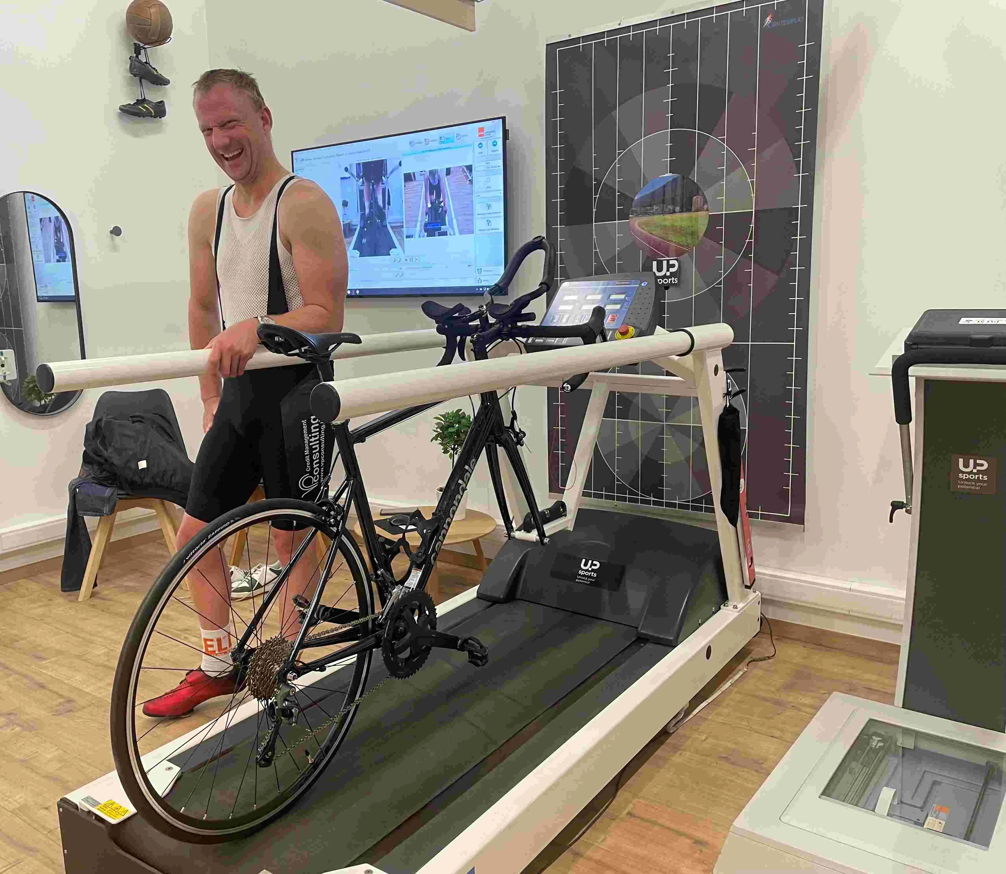 amputee stationary cycling with prosthetic foot secured to pedal