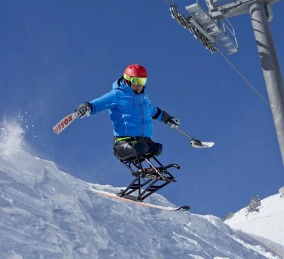 Jim Martinson using his sit ski at Crystal Mountain Resort, Washington. Photo by Jeff Caven.