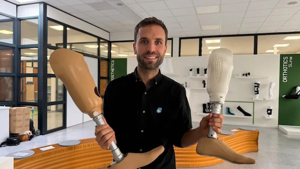 Antoine Sépulchre shows an old prosthetic leg that still contains usable materials